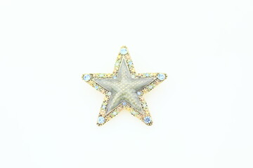 Fototapeta na wymiar Star artistic brooch pin vintage costume jewelry fashion accessory