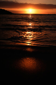 vertical sunset on the beach orange colors