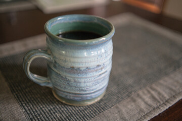 ceramic pottery mug with black coffee