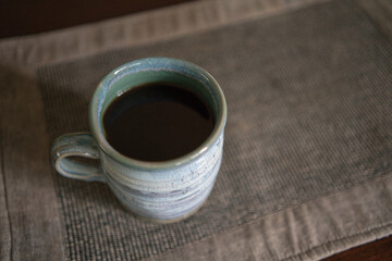 ceramic pottery mug with black coffee