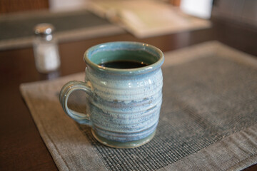 ceramic pottery mug with black coffee
