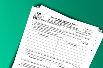 Obraz premium Form 926 documentation published IRS USA 43171. American tax document on colored
