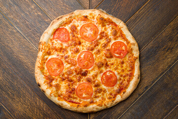 Italian pizza Margherita on wooden table top view