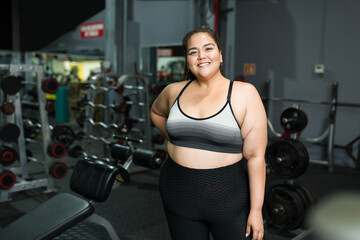 Fototapeta na wymiar Happy overweight woman losing weight with exercise