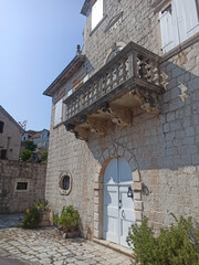 Beautiful white ancient doors in old town Perast, Montenegro