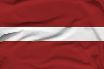 Latvia national flag, folds and hard shadows on the canvas