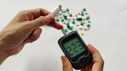 Portrait showing blood sugar level on pressure monitor, pressure gauge and Ayurvedic medicine of the diabetes patient, concept health care.
