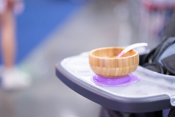 The baby food cup is made of wood so it won't fall apart and put it on the stroller