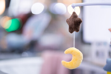 Soft toys that hang on the crib for the baby to look at and enjoy