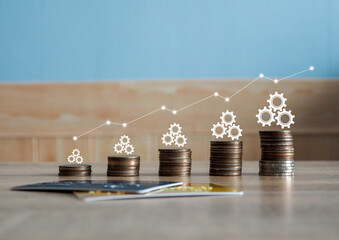 Stack of coins stacked on wooden table. Profit graph, growth, success, business concept and design, finance, marketing.