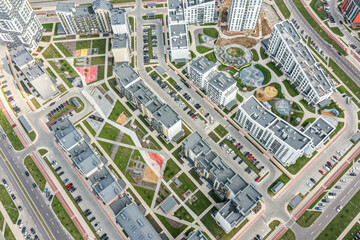 aerial view of residential district with playgrounds in courtyards and a rows of parked cars