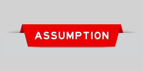 Red color inserted label with word assumption on gray background