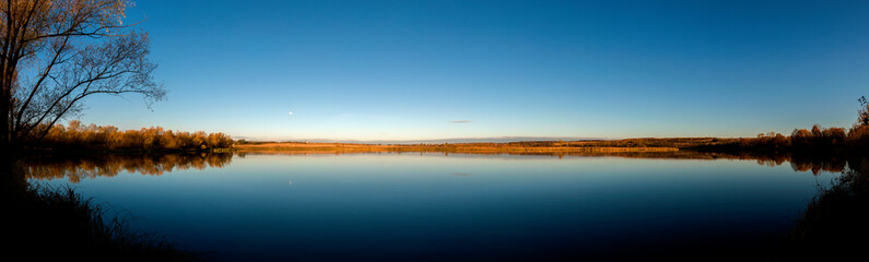 Panorama lake view in sunrise time .Sunrise at the lake