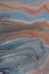 Abstract fluid art in acrylic paint in rusty earthy colours