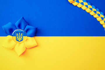 Ukraine background. Ukrainian flower trident symbol isolated on yellow blue flag banner. Flat lay,...