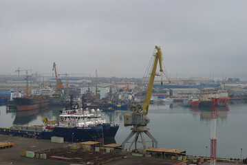 Fototapeta na wymiar Misty January morning in the Ilyich bay. Baku port