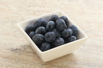 Sweet ripe blueberry heap in the bowl