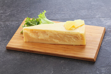 Parmesan cheese piece over board