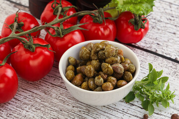 Marinated green capers in the bowl