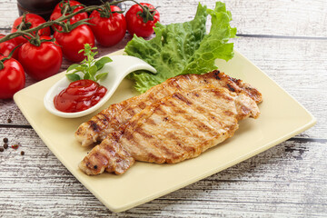 Grilled pork steak with ketchup