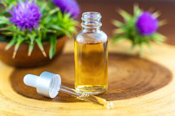 Milk thistle oil in a bottle with a pipette. Skin care.