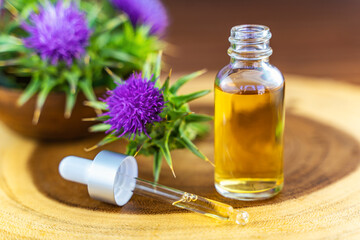 Milk thistle oil in a bottle with a pipette. Skin care.