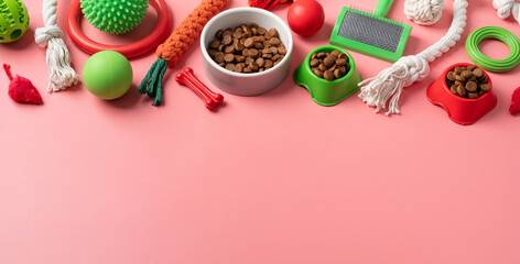 Fototapeta na wymiar Pet care concept, various pet accessories and tools on pink background, flat lay