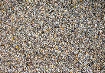 Small pebbles of crushed stone as an abstract background.