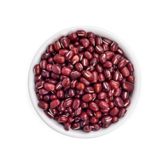 Red bean seeds in a white cup isolated on white background. Top view
