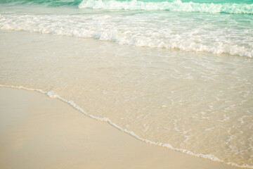 Soft wave on sand beach at coast with blue sea ocean tropical nature. tourism vacation travel summer in holidays. white texture wallpaper island flat lay.
