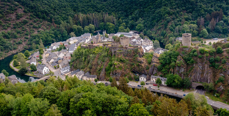 Obraz premium drone view of the picturesque village of Esch-sur-Sure on the Sauer River in northern Luxembourg