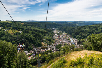 tourists on the only chairlift in Luxembourg in picturesque Vianden in the Our River Valley