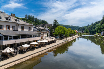 Fototapeta na wymiar picturesque riverside restaurant on the our River in the historic village center of Vianden