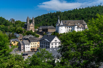 view of the picturesque and historic city center of Clervaux with castle and church in northern...