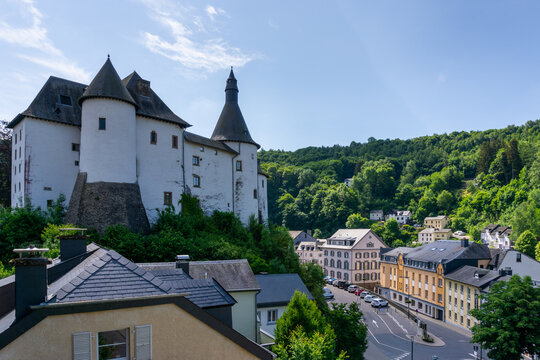 view of the picturesque and historic city center of Clervaux with castle and church in northern Luxembourg