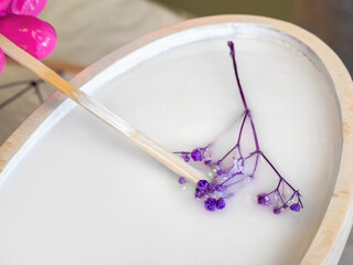 The art process of pouring epoxy resin into a wooden toy. Techno