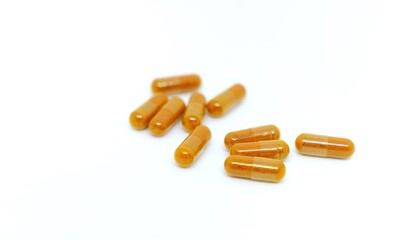Several pills laid out on a white background.