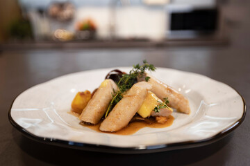 Appetizing vegetable stew with pasta on a plate in the kitchen