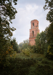 Old abandoned bell tower in russian rural area