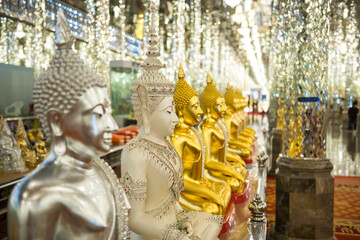 Buddha statues and  glitter glass column at Wat Tha Sung, Uthai