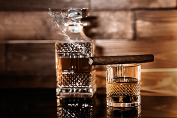 Obraz na płótnie Canvas glass of whiskey and tobacco