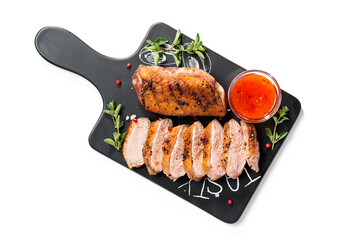Roasted duck breast served with sauce and fresh herbs. Isolated on white background, top view	