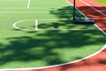 Basketball, football and athleticism sport field inside a school yard during a summer day. Sports at school.