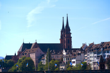 Fototapeta premium Skyline of the old town of Basel with Basler Minster on a blue cloud spring day. Photo taken May 11th, 2022, Basel, Switzerland.