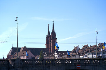 Skyline of the old town of Basel with famous Basler Münster (Basler Minster) and Middle Rhine Bridge on a sunny spring day. Photo taken May 11th, 2022, Basel, Switzerland.
