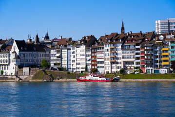 Colorful facades of historic houses at border of Rhine River on a sunny spring day. Photo taken May 11th, 2022, Basel, Switzerland.