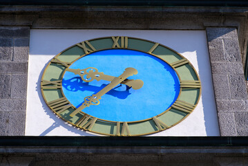 Close-up of clock at white apostolic church at the old town of Basel on a sunny spring day. Photo taken May 11th, 2022, Basel, Switzerland.