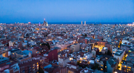 mass of roofs of houses on the spanish city of Barcelona in the evening