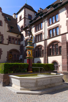 Statue of medieval soldier at fountain at the old town of City of Basel on a sunny spring day. Photo taken May 11th, 2022, Basel, Switzerland.