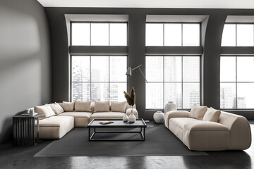 Dark living room interior with couch and coffee table, panoramic window